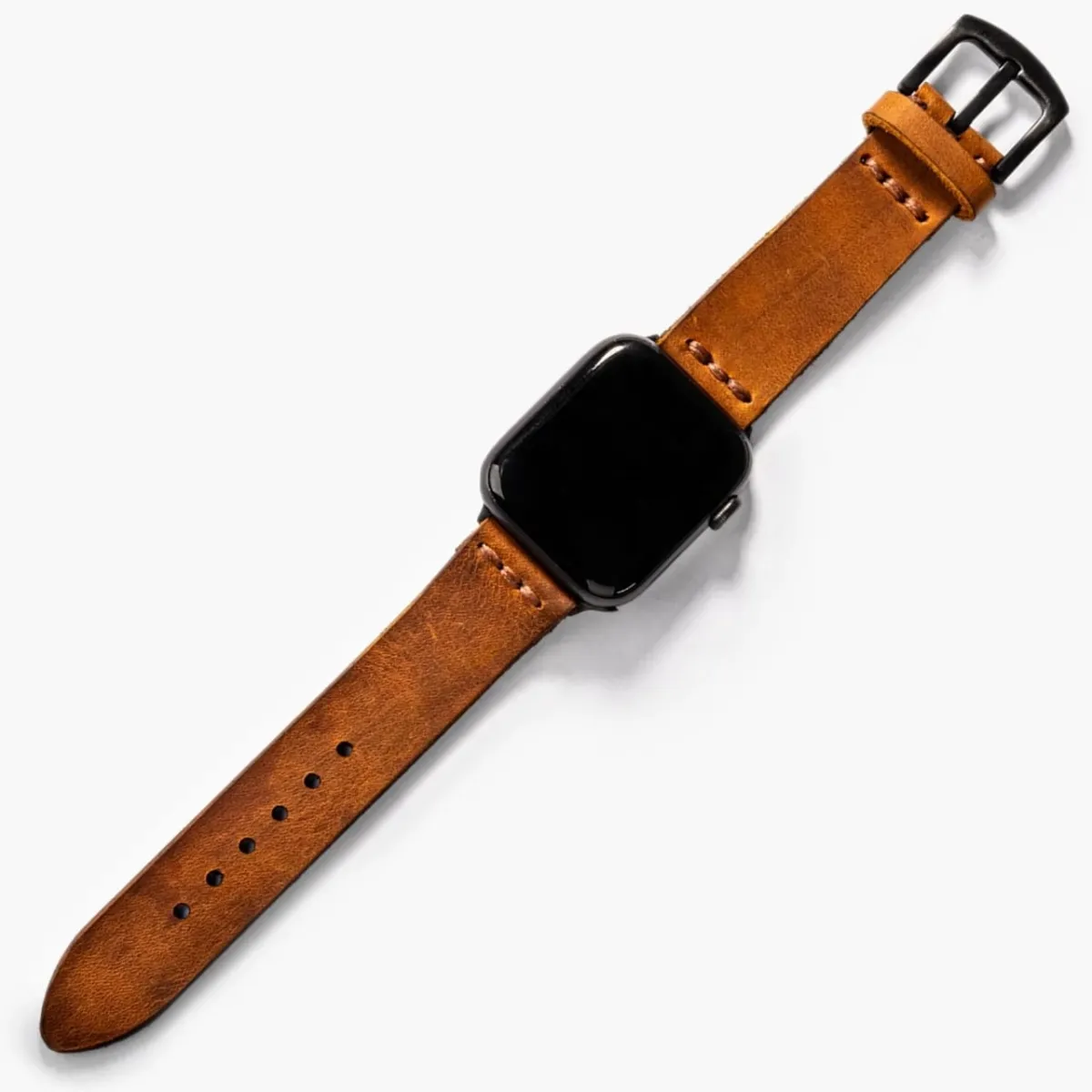 Tek Katlı Deri Apple Watch Kayışı – Cat, masa üstünde açık haliyle sergileniyor